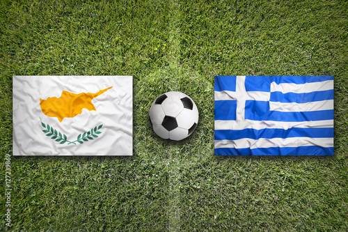 Cyprus vs. Greece flags on soccer field