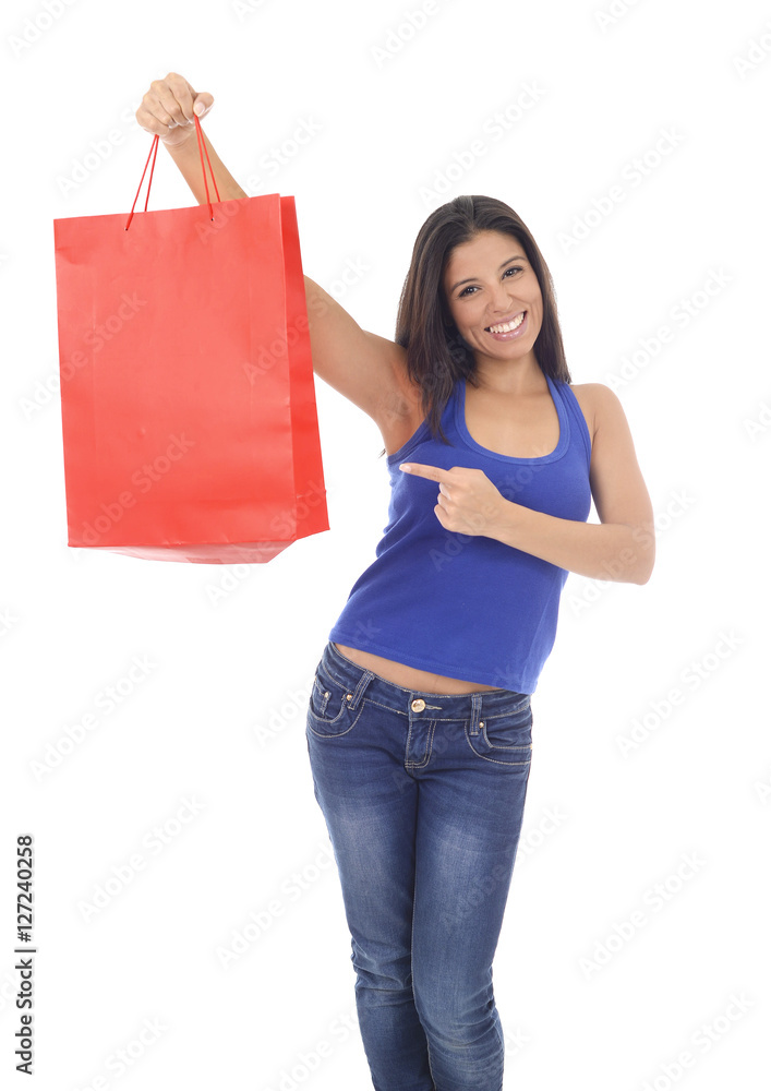 young happy and beautiful hispanic woman holding red shopping bag smiling excited isolated on white young happy and beautiful hispanic woman holding red shopping bag smiling excited isolated on white