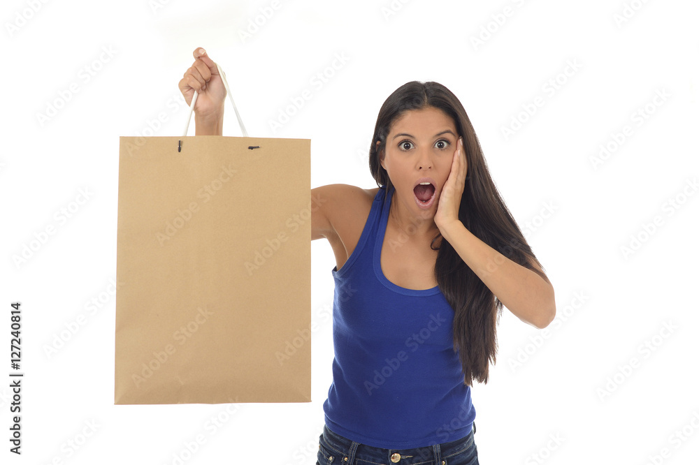 young happy and beautiful hispanic woman holding brown shopping young happy and beautiful hispanic woman holding brown shopping