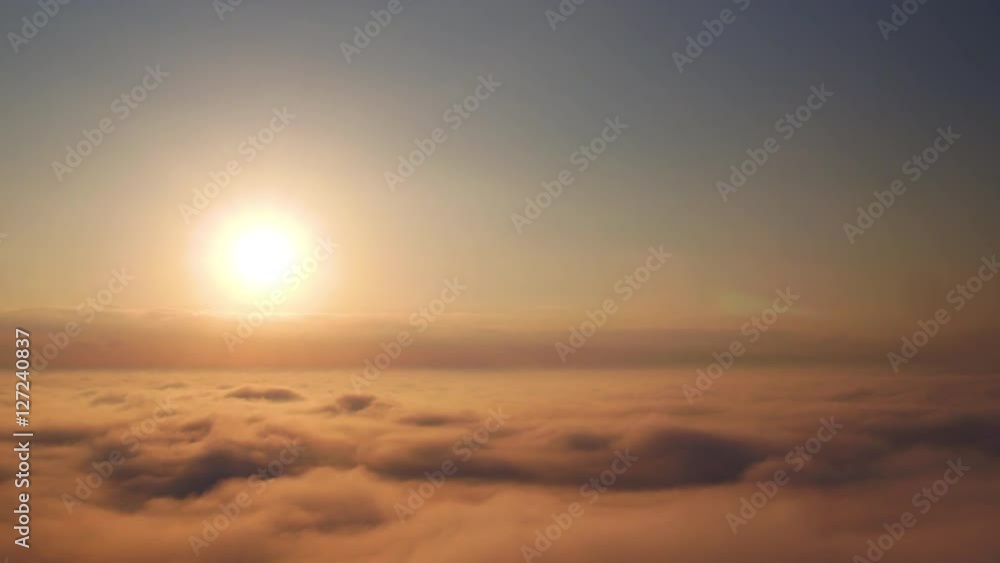Beautiful sunrise above the clouds. Aerial view. Beautiful sunrise above the clouds. Aerial view.