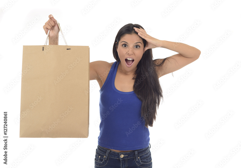young happy and beautiful hispanic woman holding brown shopping young happy and beautiful hispanic woman holding brown shopping