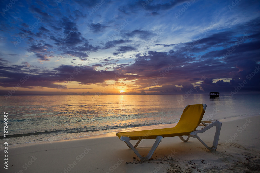 Sunbed on the beach at sunrise Sunbed on the beach at sunrise