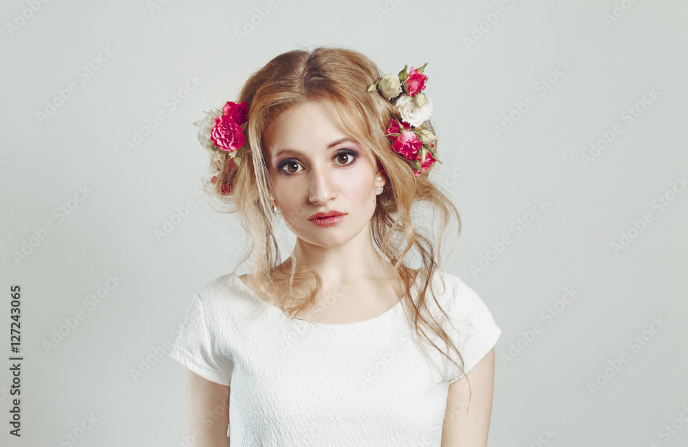 beautiful blonde with flowers in her hair. beauty