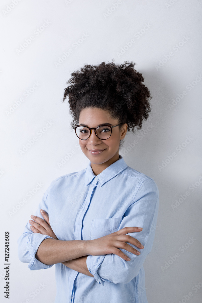 Portrait of millennial businesswoman wearing casual clothes in office Portrait of millennial businesswoman wearing casual clothes in office