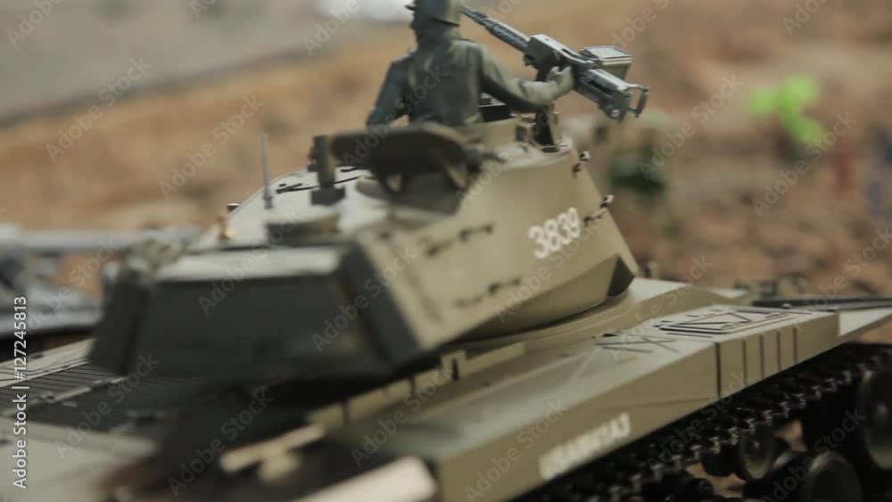 Close-up of toy tanks go and shoot Close-up of toy tanks go and shoot