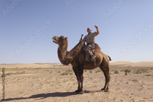 Westerner on a camel in the Gobi Desert in Mongolia © James
