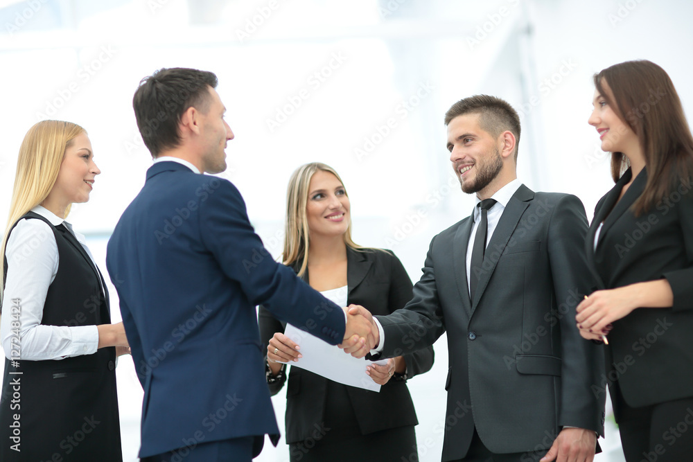 Handshake to seal a deal after a job recruitment meeting in a of Handshake to seal a deal after a job recruitment meeting in a of