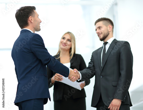 Handshake to seal a deal after a job recruitment meeting in a of