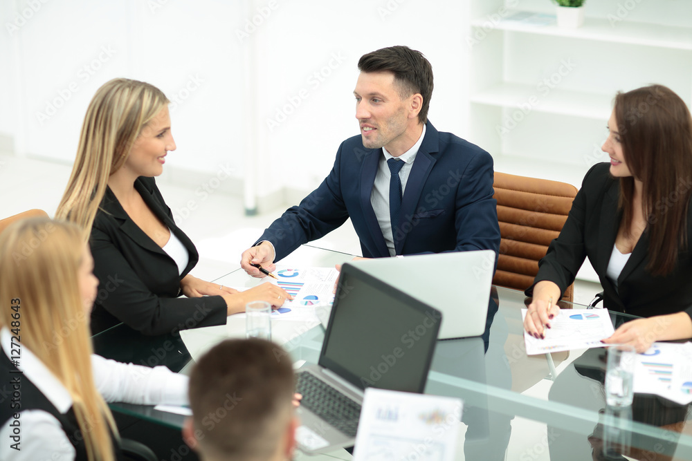 Happy business people talking on meeting at office