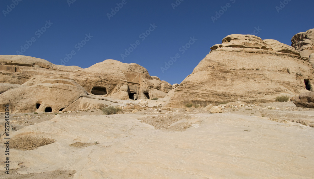 Rock cut tombs at the entrance to ancient Nabatean city of Petra, Jordan Rock cut tombs at the entrance to ancient Nabatean city of Petra, Jordan