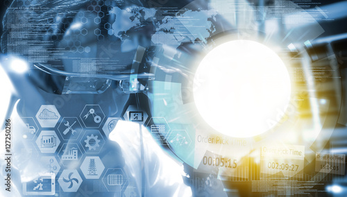 Industry 4.0, Augmented reality , iot and smart logistic concept. Man using AR glasses for check maintenance of machine in smart factory. Infographic and texts of industrial (IAR).