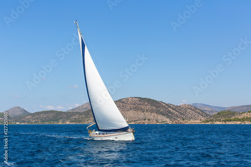 Sailboats participate in sailing regatta. Luxury Yachts.