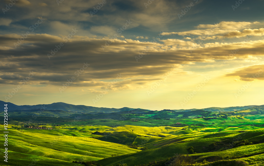 Tuscany panorama, rolling hills and green fields on sunset. Italy