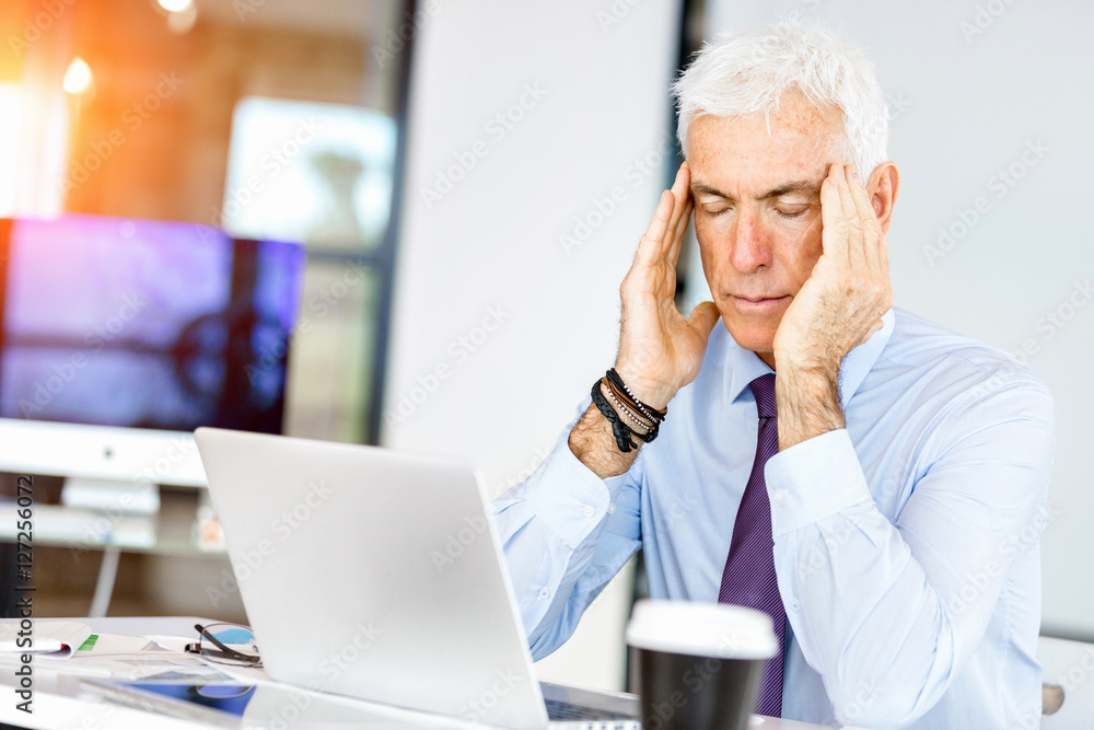 Businessman at the office tired Businessman at the office tired