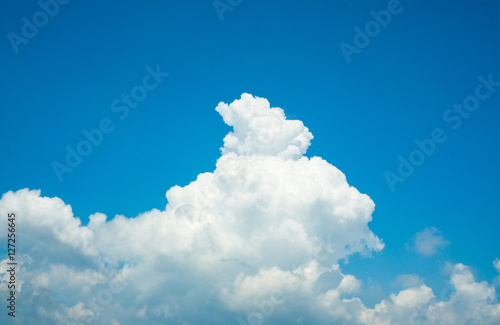 Big fluffy white clouds in the blue sky, Sunny day with cotton candy white clouds, Cloudy blue sky