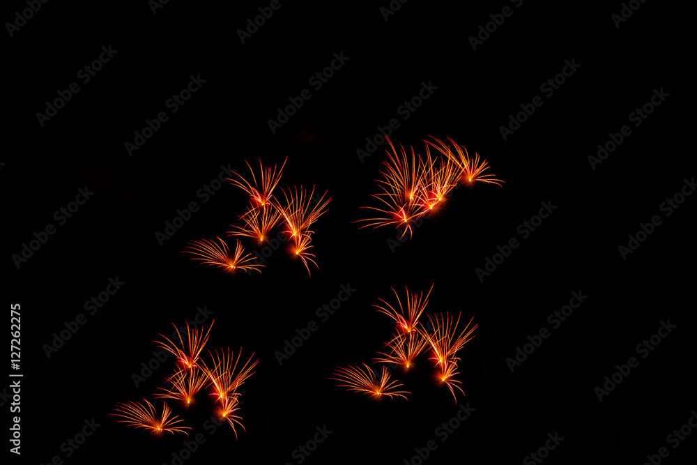 Fireworks in the night.New Year celebration fireworks,Colorful fireworks over dark sky, displayed during a celebration event Fireworks in the night.New Year celebration fireworks,Colorful fireworks over dark sky, displayed during a celebration event