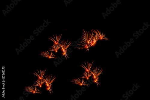 Fireworks in the night.New Year celebration fireworks,Colorful fireworks over dark sky, displayed during a celebration event