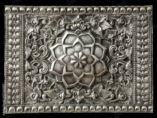 Decorative Art of Lanna Thai silver carving art on temple wall .
