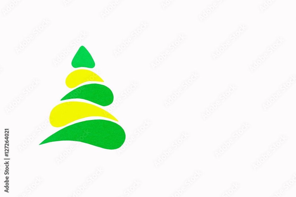 The New Year and Christmas conceptual tree made of a color cardboard. Isolated on a white background. The New Year and Christmas conceptual tree made of a color cardboard. Isolated on a white background.