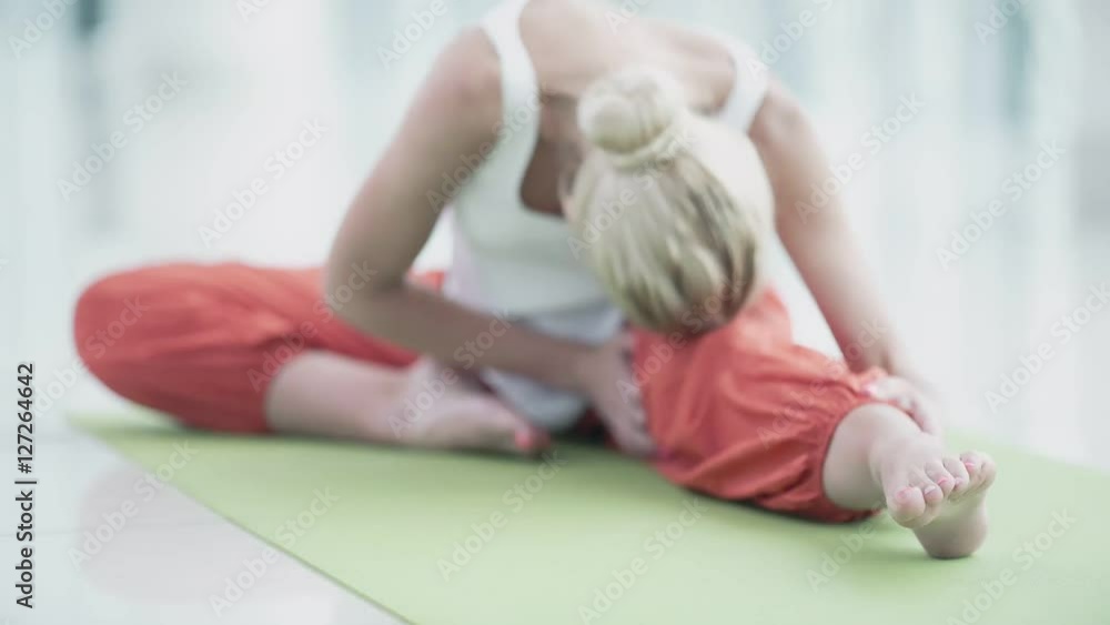 Young woman doing yoga indoors