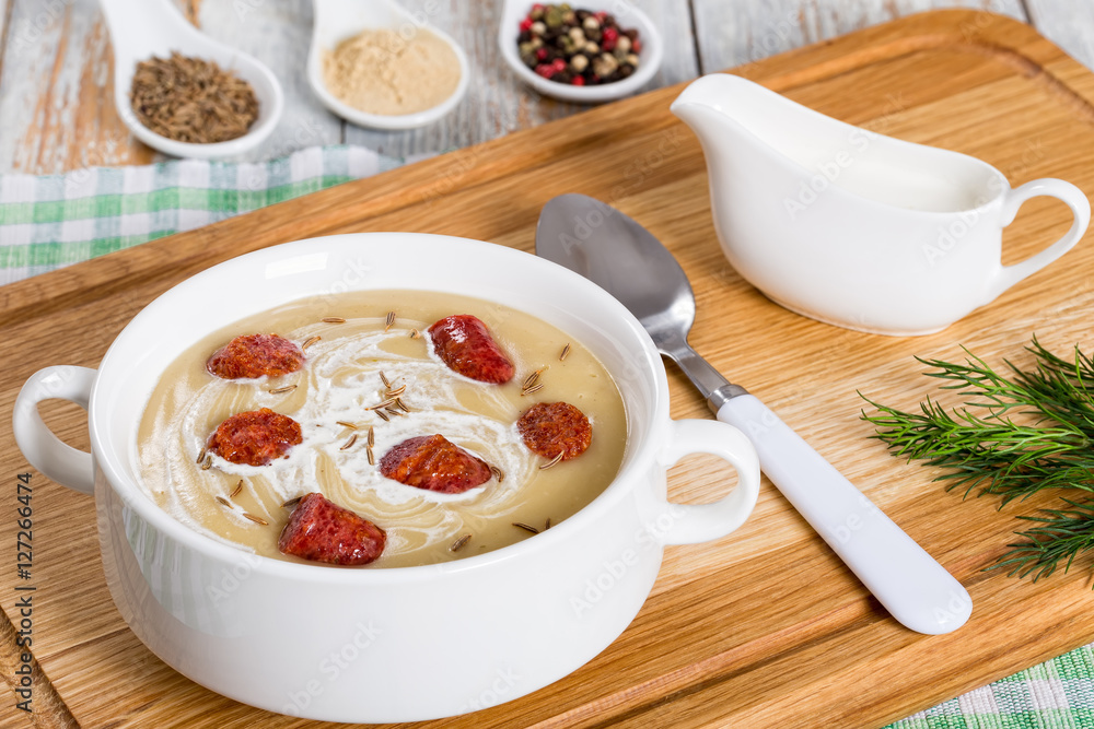 delicious Beer and cream spicy Soup with Kielbasa Sausage