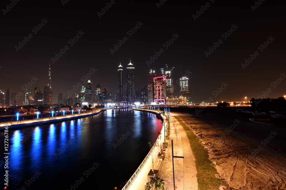 Dubai Skyline at night from new Dubai Canal, U.A.E