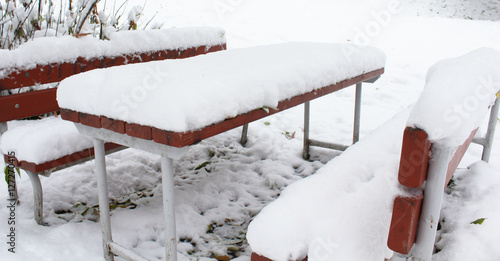 the bench and table in the snow