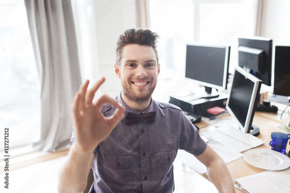 happy creative male office worker showing ok sign happy creative male office worker showing ok sign