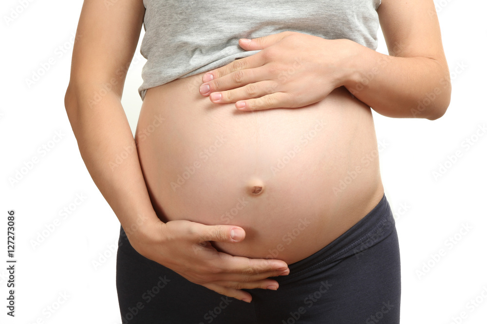 The image of the abdomen of a pregnant woman waiting for a child. The image of the abdomen of a pregnant woman waiting for a child.