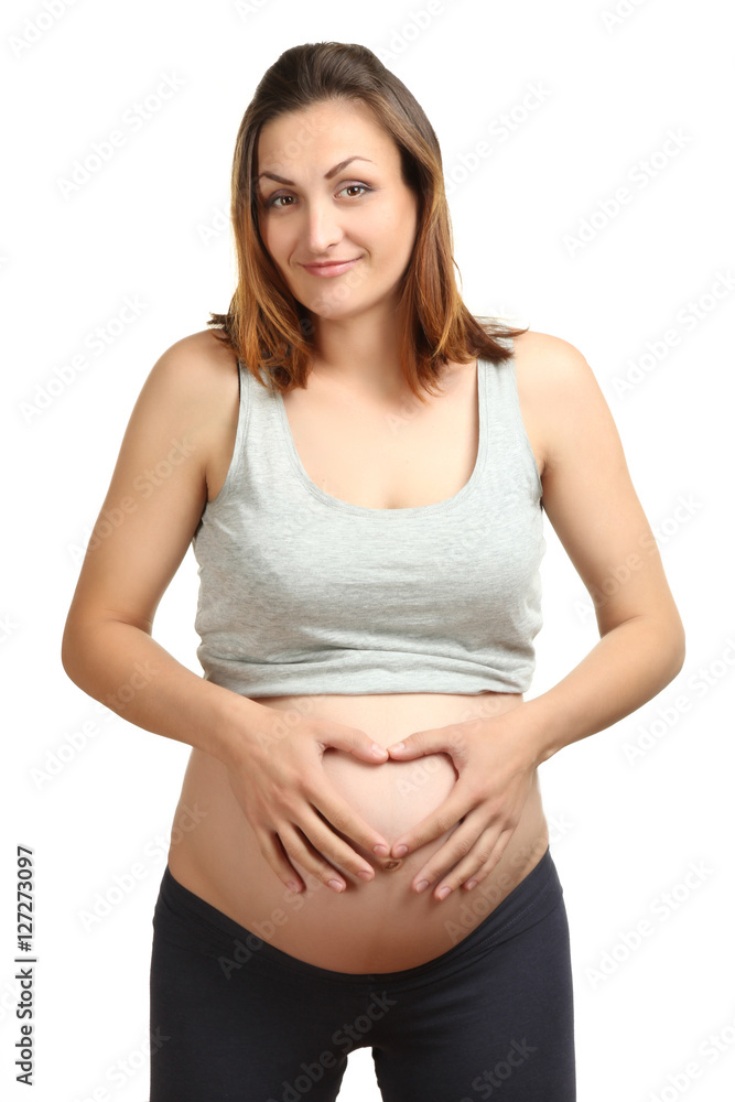Four Arms Show Heart on Stomach of Pregnant Woman Stock Photo