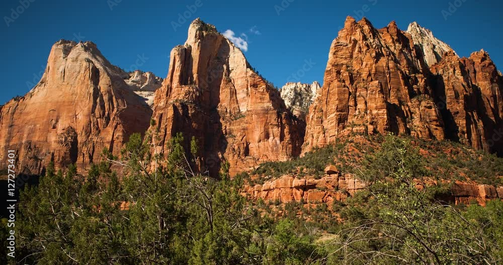 Zion National Park, Utah, USA - view at the Court of the Patriarchs at sunny day with blue sky - Timelapse with zoom in Zion National Park, Utah, USA - view at the Court of the Patriarchs at sunny day with blue sky - Timelapse with zoom in