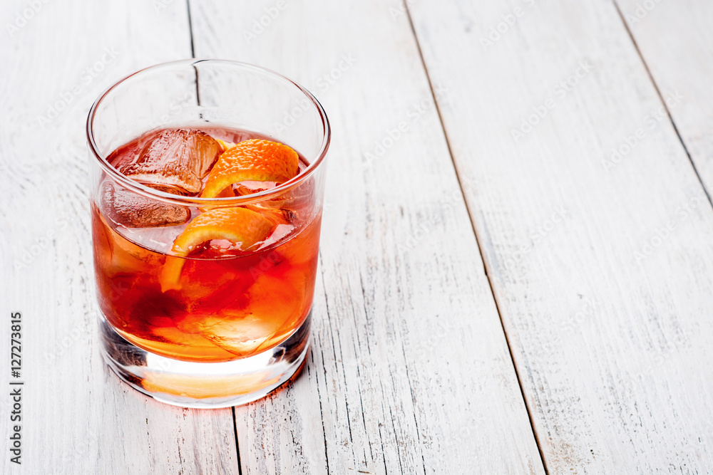 Negroni on a wooden board, white background Negroni on a wooden board, white background