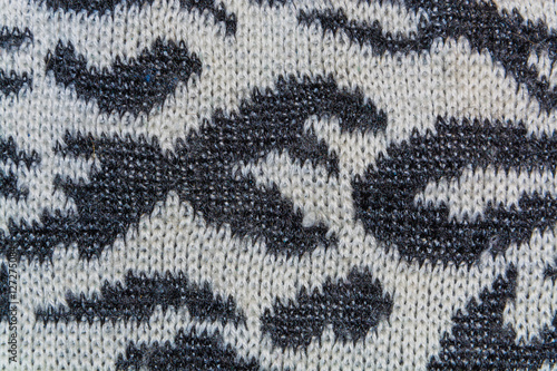 Abstract black and white texture, background of knitted woolen cloth