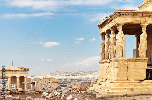 Ancient Greek Acropolis. The famous Porch of the Caryatids with six statues supporting the architrave  the southern part of the temple of the Erechtheion and fragment of the Propylaea
