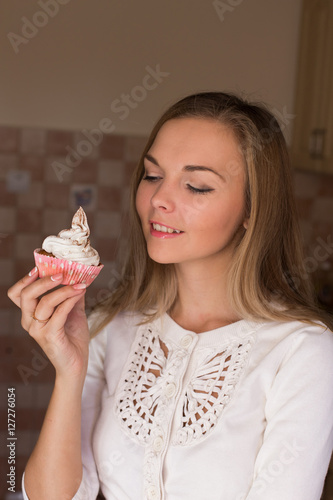 cupcakes homemade cakes in the hands of women coffee confectioner dessert coffee on a wooden background dark light pink gentle cream breakfast