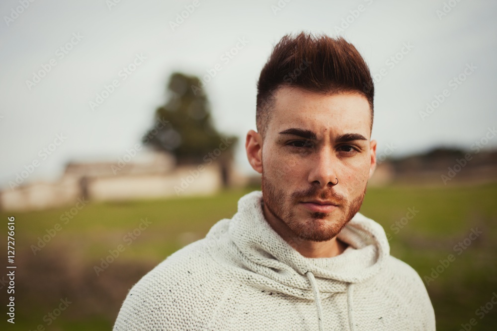Attractive guy with beard in the meadow Attractive guy with beard in the meadow