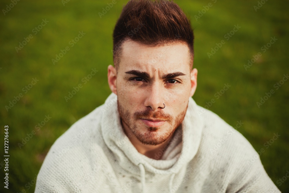 Attractive guy with beard in the meadow Attractive guy with beard in the meadow
