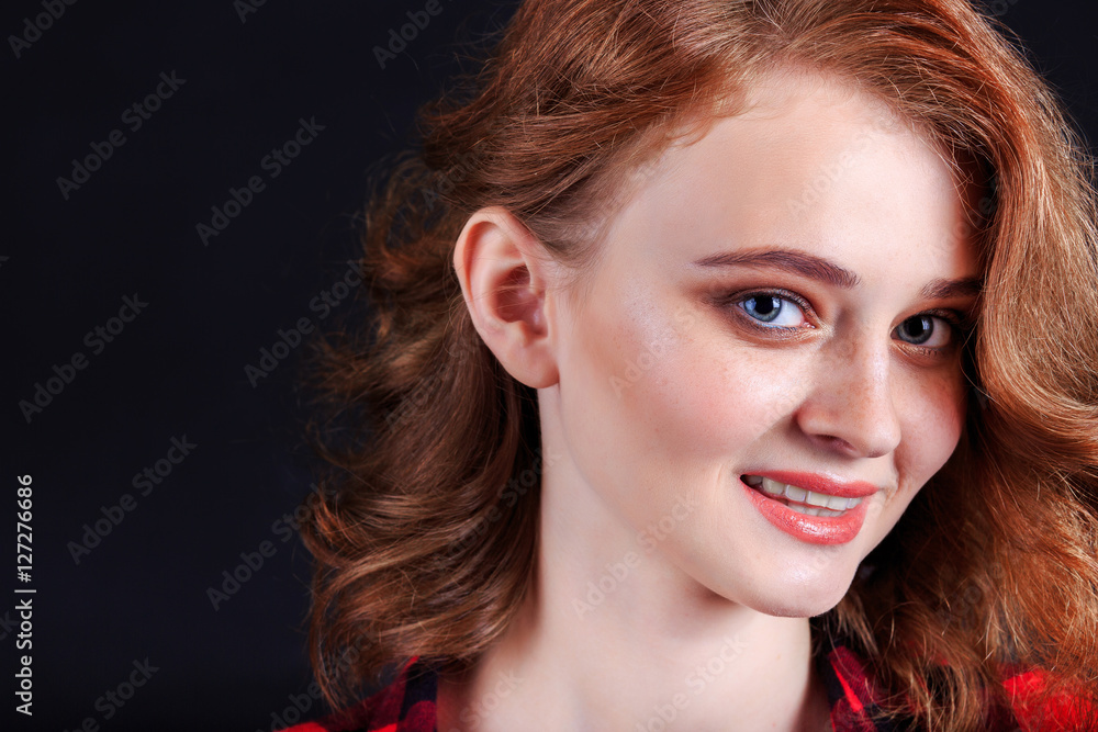Portrait of beautiful girl. Freckled woman with wavy red hair an Portrait of beautiful girl. Freckled woman with wavy red hair an