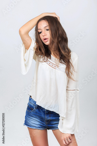 Fashion beautiful young woman model in blue jeans shorts with ma
