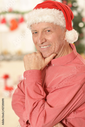 Senior man in santa hat