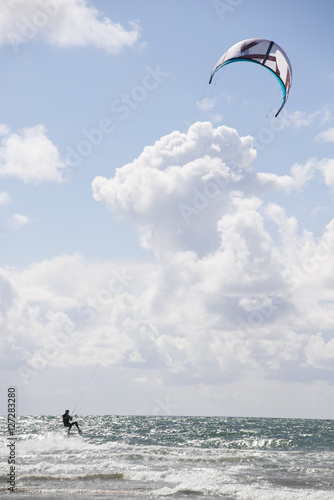 extreme kite surfer on fast ride