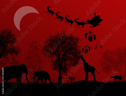 Canvas Print Santa Claus in Africa - silhouettes of wild animals and flying Santa on red nigh