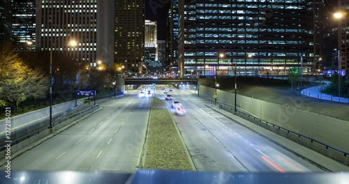 Chicago, Illinois, USA - view from the BP Pedestrian Bridge at Millennium Park at S Columbus Drive with traffic facing north at night photo