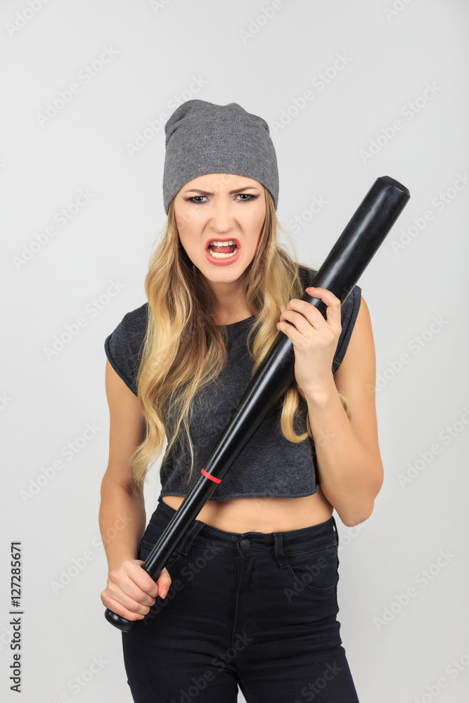 Fototapeta premium Cool hot fashionable criminal woman bandit dressed in hat with b