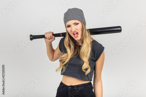 Cool hot fashionable  criminal woman bandit dressed in hat with