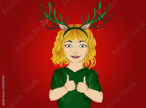 Happy little girl with Christmas deer horns on his head. 