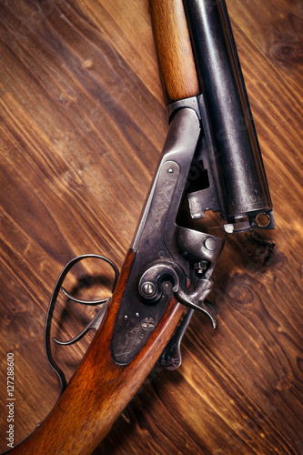 Shotgun on wooden background