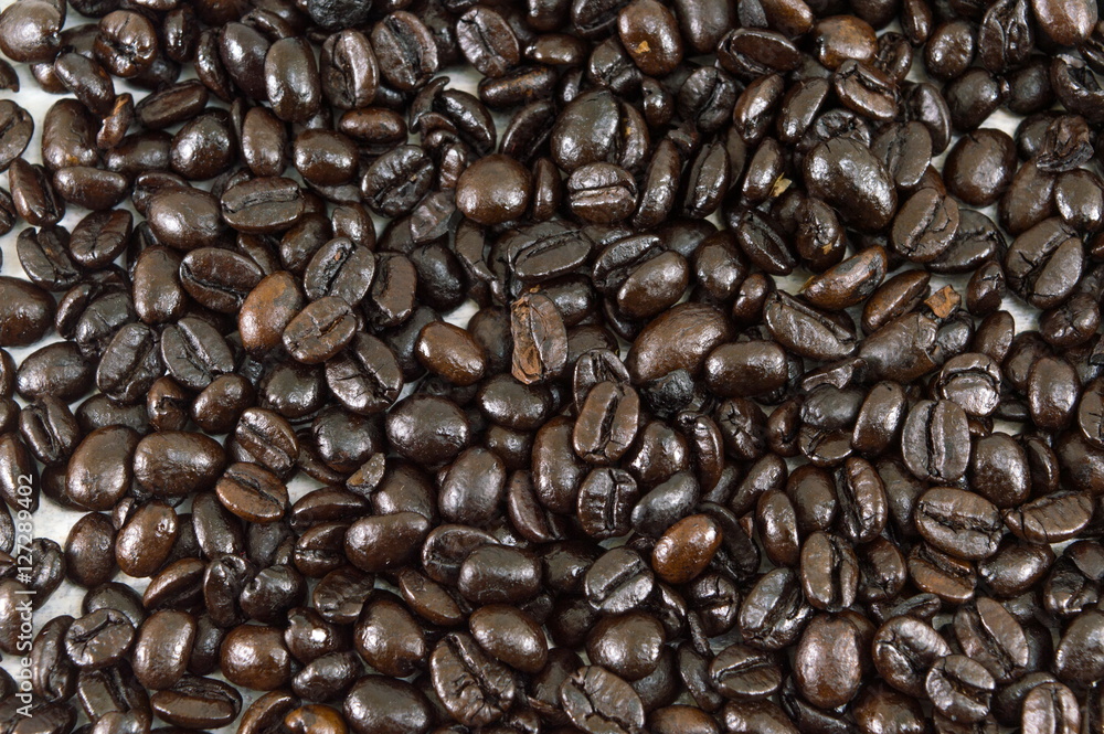 Bunch of Roasted coffee beans forming background Bunch of Roasted coffee beans forming background
