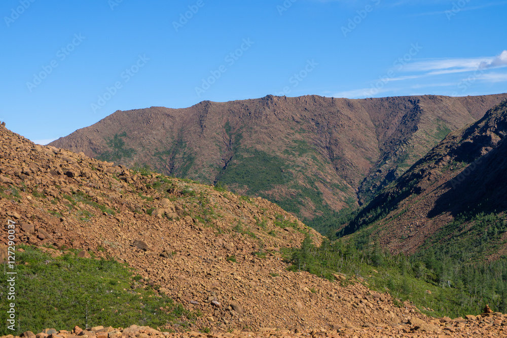 Brown rocky hills with scree slopes