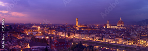 Panorama of famous Florence city and river Arno after sunset with night illumination, Tuscany, Italy, Europe. Travel outdoor sightseeing background.